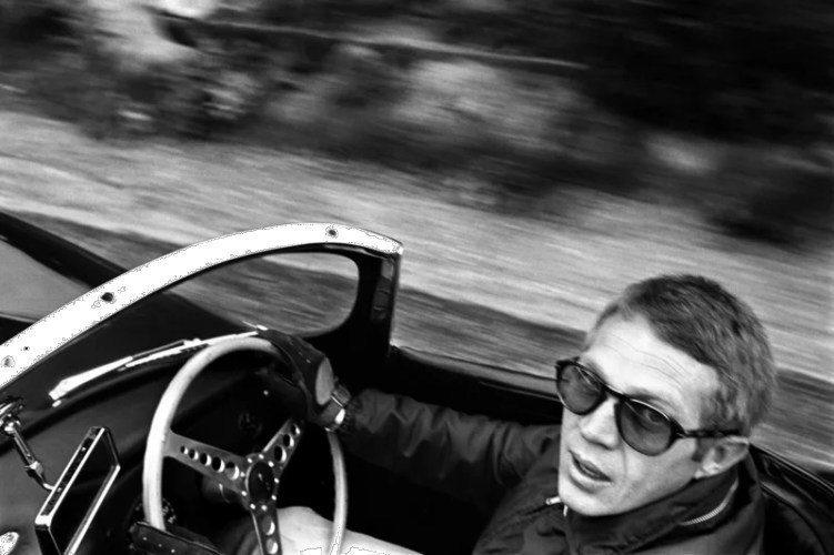 Steve McQueen in his XK-SS Jaguar, driving on Mulholland Drive, Los Angeles